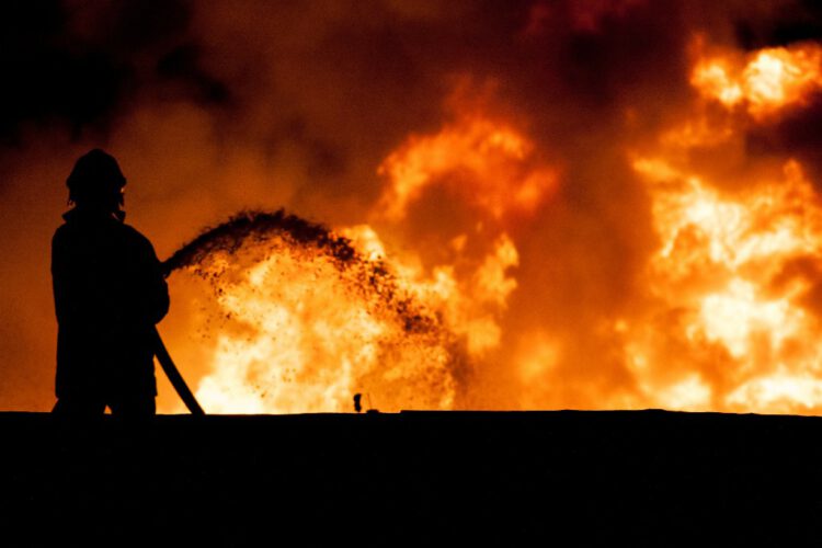 Fireman working in the night at the explosion