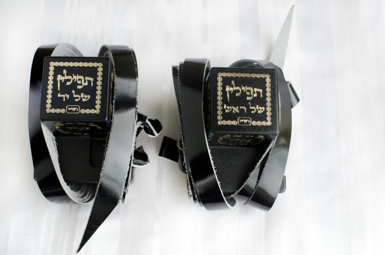 A set of tefillin includes the arm-tefillin (left)
and the head-tefillin on Talit.